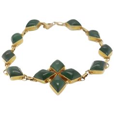 A fine vintage gold & jade chain link bracelet. In 14k yellow gold. Centered on a 4 point star device and bezel-set throughout with diamond shaped nephrite jade cabochons. Simply a wonderful Mid-Century jade necklace bracelet! Date: Mid-20th Century Overall Condition: It is in overall good, as-pictured, used estate condition. There is some light edge wear, some fine and light surface scratches, and other signs of light wear consistent with age. Fineness: Marked 14k for gold fineness. Marks: Mark Luxury Vintage Jade Bracelets, Gold Antique Bracelet, 4 Point Star, Antique Gold Bracelet, Antique Bracelets, Clasp Bracelet, Nephrite Jade, Jade Necklace, Jade Bracelet