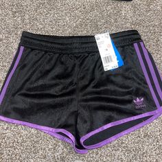 Nwt! Adidas Black And Purple Trim Dolphin Hem Shorts. Size Xs. Inner Drawstring. Semi Sparkly Three Stripe Design On Shorts. Regular/Low Waist Fit. #Adidas #Nwt #Running #Sportswear #Threestripes Purple Athleisure Shorts With Elastic Waistband, Sporty Short Purple Bottoms, Sporty Purple Short Bottoms, Sporty Purple Shorts, Casual Purple Workout Bottoms, Casual Purple Athletic Shorts, Uk Outfits, Adidas Gym Shorts, Adidas Shorts Women