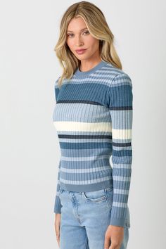 Meg Striped Sweater Indulge in luxury with our Meg Striped Sweater. Featuring a stylish color block design with blue and grey stripes, this sweater exudes sophistication and elegance. Made from premium materials, it offers both comfort and style, making it the perfect addition to your wardrobe. Elevate your fashion game with Meg. Chic Blue Color Block Tops, Chic Blue Crew Neck Sweater, Blue Striped Long Sleeve Top, Blue Horizontal Stripe Long Sleeve Top, Blue Long Sleeve Top With Horizontal Stripes, Blue Long Sleeve Tops With Horizontal Stripes, Chic Blue Ribbed Sweater, Chic Striped Fitted Sweater, Elegant Blue Ribbed Sweater