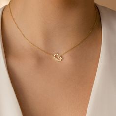 Our Mini Sideways Initial Necklace is the perfect personalized gift and timeless keepsake. With your choice of letter, this delicate, minimal design can be customized with an off-center initial to bring your whole outfit together. Material: High Quality Solid 925 Sterling Silver Finish: Sterling Silver ∙ 18K Gold ∙ Rose Gold Featuring ~12.5mm X 7mm Letter Charm SKU: MM-NM118F39 Minimalist Initial Pendant Name Necklace In White Gold, Elegant Monogram Charm Necklaces For Everyday, Minimalist White Gold Initial Pendant Necklace, Elegant Monogram Charm Necklace For Everyday, Elegant Everyday Monogram Charm Necklace, Modern Gold Initial Necklace For Anniversary, Elegant Sterling Silver Initial Necklace For Anniversary, Elegant Heart-shaped Simple Jewelry, Minimalist Monogram White Gold Necklace