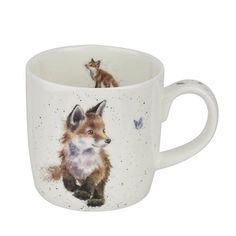 a coffee cup with an image of a fox and a bird on the inside, in front of a white background