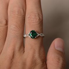 This is a gorgeous handmade creation. Its beauty is its simplicity & Elegance. The 6*8 mm oval shape faceted lab Emerald is crafted in solid sterling silver and with rhodium plated. Main stone weight about 1.13 ct. CZ as accents. All item is sent in a beautiful gift box If you have any idea of design your ring,pls contact me directly. You can realize more lovely stuff clicking the link https://www.etsy.com/shop/knightjewelry?refshopsection_shophome_leftnav Please leave the correct address an Rings Oval, May Birthstone Rings, Emerald Rings, Birthstone Rings, Wedding Ring For Her, Oval Cut Engagement Ring, Rings Unique, Engagement Ring For Her, Wedding Rings Solitaire