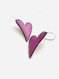 Orchid Purple heart shaped enamel earrings. Copper heart with kiln fused glass enamel. Once the enamel is fused to the copper it is a smooth glass. Heart measures 1 inch in height. Made with Sterling silver earwires. Handle as glass. Handmade in the Pacific Northwest. Ships from Seattle, WA💗 Heart Charm Enamel Earrings, Purple Heart Charm Earrings For Valentine's Day, Purple Heart-shaped Earrings For Pierced Ears, Handmade Purple Heart-shaped Jewelry, Unique Purple Heart-shaped Jewelry, Purple Heart-shaped Pierced Earrings, Heart-shaped Enamel Earrings With Charm, Copper Heart, Purple Gift