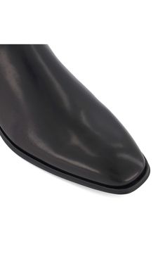 A bold, modern silhouette elevates a stylish Chelsea boot fashioned from finely textured leather. Pull-on style with elastic gore insets Leather upper/textile lining/rubber sole Imported Classic Slip-on Boots With Textured Sole, Black Chelsea Boots With Pointed Leather Sole, Black Pointed Toe Chelsea Boots With Leather Sole, Classic Chelsea Boots With Square Toe In Calf Leather, Classic Square Toe Chelsea Boots In Calf Leather, Business Chelsea Boots With Round Toe In Calf Leather, Business Heeled Boots With Leather Sole And Round Toe, Calf Leather Chelsea Boots With Round Toe For Business, Modern Ankle-high Boots With Reinforced Heel