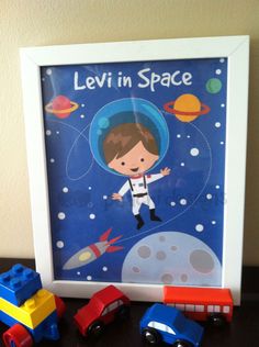 a photo frame with an image of a boy in space on it