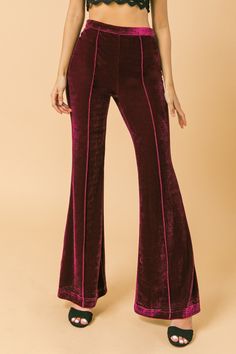 A high waisted flared velvet pant with pin tuck detail Details Self: 95% Polyester, 5% Spandex Size & Fit - Model is 5`8" and wearing size Small - Measurements taken from size Small - Length: 43" 70s Pants, Velvet Pant, 2024 Board, Velvet Flare Pants, Outfits 70s, Velvet Jeans, Velvet Flares, Fashion Vocabulary, High Waisted Flares