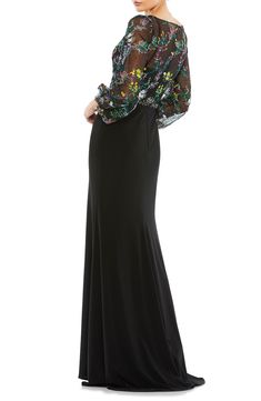 Colorful floral embroidery and tonal rhinestones enliven the mesh bodice and sheer sleeves of a captivating column gown with a floor-sweeping skirt. 62 1/2" length Surplice V-neck Long sleeves Lined 100% polyester Spot clean Imported Asian Owned/Founded Black Gowns, Puff Sleeve Gown, Sleeve Gown, Prom Designs, Designer Prom Dresses, Column Gown, Column Dress, Mac Duggal, Black Gown