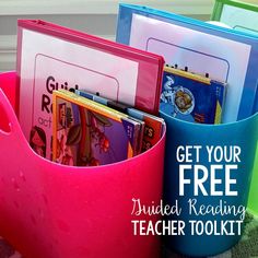 a pink bucket filled with books on top of a table