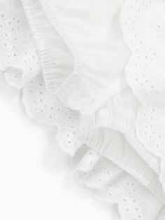 Fabric: cotton Spring Cotton Bottoms With Broderie Anglaise, Casual Cotton Bottoms With Broderie Anglaise, Spring Cotton Skirt With Broderie Anglaise, Cotton Ruffle Skirt For Daywear, White Ruffled Bottoms For Daywear, Elegant Cotton Bottoms With Ruffles, White Cotton Feminine Skirt, White Ruffled Skirt For Daywear, Feminine White Cotton Skirt