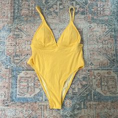 Pretty Yellow One Piece Swimsuit The Color Is Slightly Darker Than In The Photos Size Medium High Cut Removable Padding And Adjustable Straps Very Small Pull On The Left Cup. Shown In Photo No Hygienic Liner Please Feel Free To Ask Questions! Chic Yellow Beach Bodysuit, Chic Yellow Bodysuit For Beach, Chic Yellow Bodysuit For The Beach, Summer Bodysuit With Triangle Top And Lined Body, Summer Triangle Top Bodysuit, Yellow Lined Bodysuit For Vacation, Yellow Poolside Bodysuit With Lined Body, Yellow Bodysuit With Lined Body For Poolside, Yellow Lined Bodysuit For Poolside