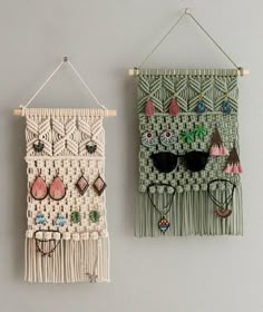 two wall hangings with sunglasses and beads on them