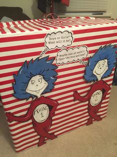 the cat in the hat box is decorated with red and white striped paper, which says