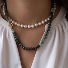 "This beautiful natural emerald necklace is handknotted with green silk cord. The beads are approx 8mm and have a natural shape to them. Not each bead is uniform which makes this necklace have character. The clasp is made with 14k solid gold. This necklace is a great staple piece. Easy to throw  on over a white blouse or T-shirt - great for day or night.   Details: ✦Natural emerald gemstones ✦14k solid gold clasp ✦ Necklace measures 20 inches ✦Handknotted with silk cord ✦Packaged in our elegant black Vivien Frank Box ✦Hallmarked with jewelers stamp and 585 (14k) ✦ Pearl necklace (in first image) can be found here https://www.etsy.com/listing/1592853266/ If you have any questions about this necklace, just hit the \"Ask a Question\" button next to the price and we will get back to you within Elegant Emerald Beaded Necklaces, Elegant Hand Knotted Beaded Necklaces For Gifts, Elegant Hand Knotted Beaded Necklace Gift, Elegant Hand-knotted Beaded Necklaces For Gifts, Elegant Green Hand-strung Necklace, Emerald Beaded Necklace Single Strand As Gift, Single Strand Emerald Beaded Necklace For Gift, Emerald Single Strand Beaded Necklace As A Gift, Emerald Single Strand Beaded Necklace For Gift