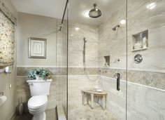 the bathroom is decorated in neutral tones