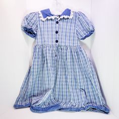 Very cute vintage girl's dress with a lace collar and very detailed buttons. No rips or stains. Totally retro looking! Vintage Blue Dress With Doll Collar, Vintage Dresses For School In Spring, Spring School Dresses With Buttons, Vintage Cotton Dress For Dress-up, Vintage Doll Collar Dress For Dress-up, Vintage Doll Collar Dress-up Dresses, Vintage Dress With Doll Collar For Dress-up, Vintage Cotton Dress For Dress-up Occasions, Vintage Dress With Lace Trim For Dress-up