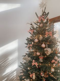 a small christmas tree with ornaments on it