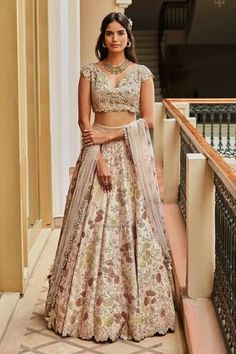 Blush lehenga with floral hand embroidered motifs and cutwork border. Paired with floral hand embroidered motifs blouse and embroidered dupatta.
Components:3
Embroidered
Neckline:V neck
Sleeve Length:Short
Fabric:Mulberry silk
Color:Peach
Floral motifs
Cutwork detail
Aari embroidery
Zardosi embroidery
Back tassel tie-up - Aza Fashions Engagement Dress For Bride Indian, Grey Lehenga, Engagement Dress For Bride, Dress For Bride, Bride Indian, Printed Lehenga, Lehenga Dupatta, Yellow Lehenga, Anamika Khanna