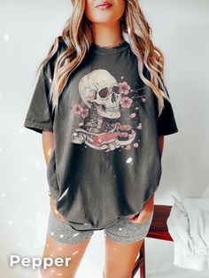 Skull Sushi T-shirt | Japanese Dream T Shirt This is a DTG (Direct to Garment) print, not Vinyl or sublimation. The design is printed directly on the shirt with garment ink. HOW TO ORDER?: Placing an order is simple! Please review all images in this listing for style, color and sizes. - Select the size and color of the shirt from the drop-down menus. - Select the quantity - Fill in the customization (if required) - Add to cart - Proceed to checkout ------------------------------ COLOURS: White I Edgy Skull Print Relaxed Fit T-shirt, Casual T-shirt With Skull Graphic Print, Spooky Black T-shirt With Skull Print, Spooky Skull Print T-shirt For Streetwear, Relaxed Fit Skull Print Graphic Tee, Edgy Skull Print Crew Neck T-shirt, Relaxed Fit Graphic Tee With Skull Print, Short Sleeve Grunge Top With Skull Print, Grunge Short Sleeve Top With Skull Print