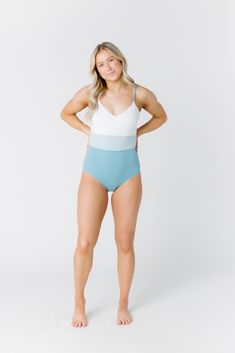 Lumi Swim - V-neck one piece swimsuit with high waisted bottom, open back with narrow straps and mid-back closure. Fully lined with foam lined cups. Approximate Swimsuit size chart: X-Small - 30-32" Small - 32-34" Medium - 34-36" Large - 36-38" X-Large - 38-40" Approximate waist measurement: X-Small - 24-26" Small - 26-28" Medium - 28-30" Large - 30-32" X-Large - 32-34" Approximate hip measurement: X-Small - 35-36" Small - 36-37" Medium - 38-39" Large - 40-41" X-Large - 41-42" Hand wash recommen V-neck Swimwear With Moderate Back Coverage For Poolside, High Waist Swimwear With Adjustable Straps For Summer, High Waist Lined Bodysuit For Beach, High-waist Bodysuit For The Beach With Lined Body, High Waist Lined Bodysuit For The Beach, High Waist Swimwear With Moderate Back Coverage For Summer, Waist Measurement, Body Poses, High Waist Bottoms