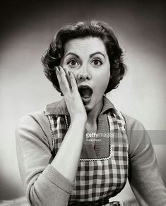 a woman making a surprised face with her hands