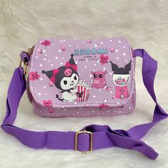 Super Cute Kuromi Showtime Hand/Shoulder/Body Bag With Double Zipper Brand New Kuromi Showtime Design With Popcorn, Gumball Machine, Teddy Bear And Stars Design In Front Star And Gum Design All Around Pastel Purple Bag With Purple Strap Magnetic Clasp For Flap Has Double Pouch And Zipper Inside Can Be Used As A Shoulder Bag, Handbag Or Messenger Bag Approx. 7.75 In.W X 6 In. H Strap Can Be Adjusted As Small As 24 Inches Long (Approx. 7.75 In. W X 15.25 In. H With Smallest Strap Size) Attachable Cute Purple Shoulder Bag For School, Purple Kawaii Shoulder Bag For Travel, Kawaii Purple Shoulder Bag For Travel, Harajuku Style Purple School Bag, Portable Purple Satchel Shoulder Bag, Cute Purple Satchel Bag, Purple Satchel Shoulder Bag, Purple Satchel Mobile Phone Bag, Purple School Bag With Mobile Phone Pocket