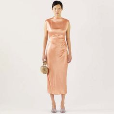 The rejina pyo delilah dress in acetate satin pink is a sleeveless midi dress with crafted from slightly wrinkled light-reflecting acetate. it features a mock neck with an invisible zipper on one side a gathered waistline for definition and an invisible side zipper as closure. this dress is designed to fit to your natural figure.    made in south korea. shell: 100% acetate. lining: 52% viscose rayon 48% polyester.    model is 173cm tall and is wearing a size uk 8.    rejina pyo is a korean desig Pre-draped Satin Midi Dress For Spring, Pre-draped Sleeveless Silk Satin Dress, Silk Midi Dress With Folds For Cocktail, Fitted Silk Midi Dress With Folds, Sleeveless Midi Dress With Pleated Bodice For Gala, Pre-draped Satin Midi Dress, Sleeveless Satin Dress With Pleated Bodice For Cocktail, Sleeveless Satin Dress With Ruched Bodice For Summer, Ruched Sheath Midi Dress For Gala