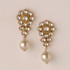 *It is Handmade Indian Ethnic Kundan Earrings. *It is made from Silver and Copper with White Kundan Stones Settings and Pearl Drops with 22k gold Plating as shown in picture. *It gives Pure Ethnic Look with Ethnic Touch and is 1.5 inches Long. *Our all jewelry is made from semiprecious stones and beads. *WARRANTY: ITS GENUINE HANDMADE JEWELRY AND WE GIVE LONG LIFE WARRANTY FOR OUR ALL ITEMS. All of our Kundan Jewelry is 100% handmade with ancient Kundan stone setting method using silver foils. I Traditional Pearl Drop Dangle Beaded Earrings, Traditional Pearl Drop Beaded Dangle Earrings, White Bohemian Earrings For Diwali, Bohemian White Earrings For Diwali, Traditional Handmade Flower Earrings For Wedding, Traditional Dangle Flower Earrings For Festive Occasions, Traditional Handmade Flower Earrings, Traditional Festive Beaded Pearl Drop Earrings, Traditional Festive Beaded Earrings With Pearl Drop