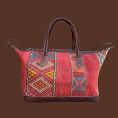 You're going to want to plan a weekend trip just so you can use this beautiful bag! Intertwined's beautifully crafted travel bag is handmade in Morocco from locally tanned leather and vintage, handwoven kilim. Each kilim is one-of-a-kind and handwoven with unique colors and patterns based on the region where it is made. Bohemian Leather Tote Travel Bag, Traditional Travel Satchel With Handles, Bohemian Leather Rectangular Travel Bag, Traditional Handwoven Satchel For Travel, Bohemian Leather Travel Bag, Bohemian Brown Travel Bag For Everyday Use, Bohemian Handmade Satchel For Travel, Bohemian Brown Satchel Travel Bag, Traditional Rectangular Satchel For Travel