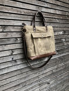 Briefcase made from heavy weight waxed filter twill in the colour ranger tan and oiled leather in the color bordeaux brown, I love the combination of these to materials. I made it big enough for laptop , and all your other necessaties. This bag is lined with a cotton canvas and there is a double inside pocket on one side. There is a large outside pocket where you can store your laptop charger and other stuff and a luggage handle attachment on the back side It closes with a metal zipper and the s Men Purse, Wax Canvas, Canvas Satchel, Man Purse, Laptop Charger, Denim Crafts, Waxed Canvas, Bag Bag, Metal Zipper