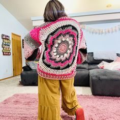 Whimsical Windmill Cardi - A Sustainable Crochet Masterpiece 🌸✨ Embrace warmth, style, and sustainability with our handcrafted Whimsical Windmill Cardi! ✨🌸 Description: Introducing the Whimsical Windmill Cardi, a true embodiment of eco-conscious fashion. Crafted entirely from leftover yarn scraps, this unique piece ensures that no material goes to waste. I was sure to try and pick a pink, black, gray and white color scheme so the colors would blend harmoniously to create a stunning, cohesive design. This chunky, oversized cardigan is not only a statement of style but also a commitment to sustainability. Features: *Hand-Crocheted Artistry: This cardi is meticulously crafted by hand, ensuring a unique and personal touch in every piece. *Sustainable Design: Made exclusively from leftover ya Handmade Bohemian Pink Cardigan, Bohemian Yarn Outerwear For Winter, Handmade Pink Bohemian Cardigan, Pink Bohemian Crochet Outerwear, Hand Knitted Bohemian Pink Sweater, Pink Hand Knitted Bohemian Sweater, Pink Bohemian Hand-knitted Sweater, Pink Bohemian Hand Knitted Sweater, Handmade Artisan Winter Outerwear