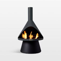 a black fireplace with flames burning in it's side and the top half open