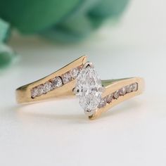 a close up of a diamond ring on a table