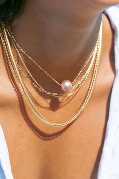 *Limited Edition* An unfailing new classic. This Edison Floating Pearl Necklace is a steadfast companion. Seemingly plucked straight from the ocean, the near round mauve pink pearl flutters along a delicate gold filled chain. This piece is striking solo or makes a bold statement layered with with a bevy of other beauties. ✦ CHOOSE YOUR ADJUSTABLE LENGTH ✦ ✦ DETAILS ✦ ✧ Name: Lokapele (lo kah PEH leh) - beautiful rose. ✧ Large 12mm-13mm Natural Mauve Edison Pearl ✧ Color will vary slightly.  ✧ 18 Elegant Pink Pearl Charm Jewelry, Elegant Pink Pearl Necklace With Pendant, Luxury Pink Necklace With Pearl Pendant, Elegant Pink Akoya Pearl Necklace, Classic Pink Akoya Pearl Jewelry, Luxury Pink Pearl Necklace, Classic Pink Pearl Chain Jewelry, Elegant Pink Akoya Pearl Jewelry, Formal Pink Pearl Charm Necklace