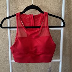 Brand New Sports Bra Red Racerback Sports Bra With Medium Support, Red High Stretch Sleeveless Sports Bra, Red Breathable Activewear, Functional Red Sports Top, Red Nylon Sleeveless Top, Red Breathable Athleisure Tops, Red Breathable Fitted Activewear, Functional Red Gym Tops, Red Functional Tops For Gym