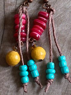 "These beautiful dangle earrings are made with copper ear wires, turquoise blue seed beads on a hemp tassel, red shell beads, amber faceted glass & faceted golden marble beads. The small amber faceted czech glass beads really sparkle! I tried to photograph them at different angles so that you could see how they capture the light. From the top of the ear wire to the bottom measures 2.5\" Please take a few moments to browse through my shop. I have a large selection of unique belt buckles, leat Golden Marble, Beaded Tassel Earrings, Bohemian Earrings, Beaded Tassels, Shell Beads, Faceted Glass, Hippie Chic, Czech Glass Beads, Tassel Earrings