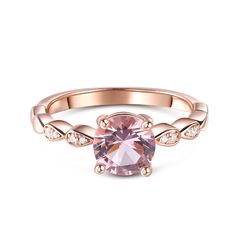 Capture her heart with this stunning morganite rose gold engagement ring. Stunning in Sterling Silver, the eye is drawn to a sparkling round cut morganite stone at the center, while the side stones adds more elegance and sparkle to the design. Additional side stones line the polished shank to assure sparkle from any angle. This engagement ring is a bright symbol of your love.Carat Weight: 1.25 ctStone Size: 7 mmNumber of Stones: 1 Stone Shape: RoundStone Color: Fancy PinkCarat Weight: 0.066 ctStone Size: 1.1,0.9 mmStone Type: Jeulia® StoneNumber of Stones: 8 Stone Shape: RoundStone Color: Diamond WhiteWeight: 2.39 gWidth: 2.1 mmHeight: 5.6 mmThickness: 1.2 mmMaterial: 925 SilverPlating Color: Rose Gold Morganite Rose Gold Engagement Ring, Morganite Engagement Ring Rose Gold, Rose Gold Morganite, Rose Gold Engagement, Halloween Sale, Rose Gold Engagement Ring, Gold Engagement, Morganite, Quality Jewelry