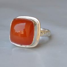 Materials: Sterling Silver, 14K Yellow Gold Fill, 14K Rose Gold Fill Gemstone: Orange Carnelian Gemstone Dimension : 12 mm Natural Orange Carnelian 925 Sterling Silver, 14K Yellow Gold Fill, 14K Rose Gold Fill Ring, Dainty Statement August Birthstone Ring Jewelry NEW 22 DEC ------------------------------------------------------------------------------------------------------------------------------------------------- Each gemstone jewelry displayed at my shop is available in all shapes & sizes, We accept custom order and bulk order also, feel free to contact me for any queries regarding Custom or bulk order. Note:   There will be slight changes During Photography in all the gemstones in shade and texture in the actual product that you receive as these are made from natural gemstones. Stone Carnelian Jewelry With Polished Finish For Weddings, Anniversary Carnelian Rings With Polished Finish, Carnelian Cabochon Jewelry For Anniversary, Amber Carnelian Rings For Anniversary, Carnelian Gemstone Rings For Anniversary, Carnelian Ring Jewelry For Anniversary, Orange Cabochon Jewelry For Anniversary, Carnelian Ring For Anniversary, Orange Carnelian Jewelry For Anniversary