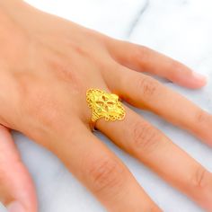 This intricate and trendy ring, crafted from 22k gold and weighing 3.7 grams, features a stunning yellow gold finish. With a ring size of 8.5, this piece combines contemporary design with timeless elegance. The availability of ring sizing ensures a perfect fit for every individual. Ideal for those seeking a fashionable yet sophisticated addition to their jewelry collection, this ring stands out with its detailed craftsmanship and luxurious appeal, adding a touch of modern sophistication to any look. Product Details Gold Purity(karat): 22k Gold Weight(grams): 3.7 Item Finish: Yellow Gold Ring Size: ﻿8.5﻿ Ring Sizing Available: Yes // Elegant Yellow Hallmarked Signet Ring, Gold Plated Yellow Gold Engraved Wedding Ring, Gold Filigree Open Ring, 22k Gold Filigree Ring With Intricate Design For Wedding, 22k Gold Filigree Ring For Wedding, Yellow Gold Plated Engraved Ring For Wedding, Gold Filigree Open Ring For Anniversary, 22k Yellow Gold Filigree Ring For Wedding, Engraved Gold Plated Ring In Yellow Gold For Wedding