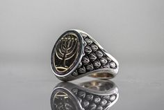 Sterling silver signet ring with ancient Menorah on top The Menorah is made of Brass, and the ring is Sterling silver. This ring have a very dominant and fancy look. All my rings are unique and designed and manufactured by me in my studio, so you can be sure that this ring is one of a kind. The default finish will be mirror polish but you can order the ring in a satin mat finish or rustic black like the last photo. Total time for making the ring is 3 days and another 5-7 days with the express de Classic Sterling Silver Signet Ring For Ceremonial Events, Handmade Sterling Silver Signet Ring For Ceremonial Occasions, Ceremonial Sterling Silver Hallmarked Signet Ring, Handmade Sterling Silver Signet Ring For Ceremonial Use, Ceremonial Hallmarked Sterling Silver Signet Ring, Antique Sterling Silver Signet Ring For Ceremonial Occasions, Mens Pinky Ring, Gift Husband, Silver Signet Ring