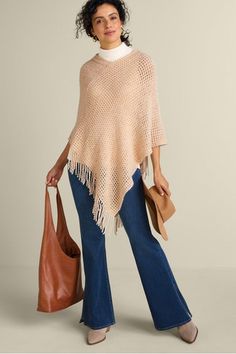 Turn on the shine in this sparkly knit poncho boasting easy-to-pair neutrals and flouncy fringe trim. It's a great accessory for everything from attending a dinner party to going wine tasting. Where will you show off your shimmer? Knit Poncho, Jumpsuit Skirt, Eyelet Top, Knitted Poncho, Velvet Tops, Tunic Shirt, Soft Surroundings, Fringe Trim, Tunic Sweater