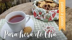 a cup of tea and some cookies on a table with the words para hora de cha