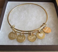 Personalized Adjustable Gold Bangle, Gold Charm Bracelet, Bridesmaid Bracelet, Custom Bracelet Gift, Initial Bracelet, Birthday Gift Ideas ❤️**ABOUT THIS BRACELET** **SEE MEASUREMENTS BELOW** This adjustable personalized bracelet features a shiny and polished gold plated bangle that is beautifully adorned with up to six 14kt gold filled 1/2 inch engraved discs. This is a feminine but sturdy bangle made from heavy 13 gauge metal. There are two double loops that you can gently squeeze together to Gold Bracelets With Charms For Birthday Gift, Adjustable Gold Bracelet For Bridesmaid Gift, Adjustable Gold Bracelets For Bridesmaids, Personalized Gold Charm Bracelet For Bridesmaid Gift, Gold Bangle Charm Bracelet For Birthday, Birthday Gift Bracelets With Charms, Adjustable Bangle For Bridesmaid Gift, Round Charms Bracelets For Birthday Gift, Charms Bracelets For Birthday Gift