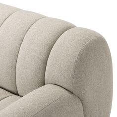 an upholstered couch with curved back and arms