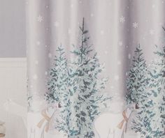 the shower curtain is decorated with snowflakes and deers in front of trees