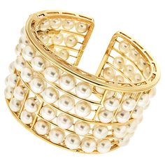 Pearls provide a lustrous complement to this bracelet. 18k yellow gold forms the cuff, which has varying openwork rows. Akoya pearls are strung on gold wires in these rows, giving the impression to be floating. The total weight of the pearls is 76 carats. Closed by a hidden hinge, the bracelet measures 2.74 inches (width) by 2.32 inches (length) by 0.87 inches (height). Yellow Gold Cuff Bracelet, Keshi Pearl Bracelet, Keshi Pearl Necklace, Vintage Cuff Bracelet, Flexible Bracelet, Modern Bracelets, Antique Bracelets, Gold Bead Bracelets, Gold Bracelet Cuff