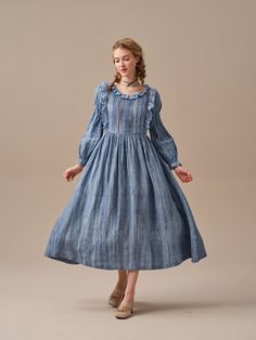 "This ruffled linen midi dress is full of romance and whimsy. This stunning linen dress in MidnightBlue uses ancient tie-dye techniques to create a unique gradient effect that gently unfolds into a cloud-like pattern. It's sure to turn heads! Flattering ruffles paired with soft pintucks add an elegant feminine touch and speaks to romantic nights dancing under a star studded sky or long lunches in the garden with friends.  Carefully crafted cutout details at the front and back create a mysterious and alluring atmosphere. Whether you choose a classic and timeless white dress or a bold and vibrant MidnightBlue hue, you'll fall in love. Note: No two patterns are alike, due to the nature of the hand-dyeing process. 【Fabric】 Main: 100% linen, around 200g/gram. Medium weight. Lace: 100% cotton. a Cottagecore Maxi Dress With Ruffles, Elegant Spring Prairie Dress For Gatherings, Flowy Cottagecore Dress With Ruffles, Cottagecore Flowy Dress With Ruffles, Bohemian Linen Maxi Dress With Ruffles, Cottagecore Midi Dress With Ruffles, Elegant Ruffled Midi Dress For Gatherings, Elegant Midi Linen Dress With Ruffles, Spring Regency Style Dress With Ruffles