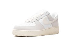 The Nike Air Force 1 Low "Sail/Platinum Tint" is a casual colorway of the retro basketball shoe with a clean appearance.  The colorway features white leather on the perforated toe and mid-panel and Platinum Tint (light grey) suede on the forefoot, collar, and heel.  A Sail leather Swoosh logo can be found on the sides.  Classic “Nike Air” and “Air Force 1” branding appear on the heel and tongue tag, respectively.  The shoe’s solid Sail rubber sole completes the look. Retro Basketball Shoes, Retro Basketball, Nike Air Force 1 Low, Stadium Goods, Swoosh Logo, Grey Suede, Air Force 1 Low, Gray Suede, Nike Air Force 1