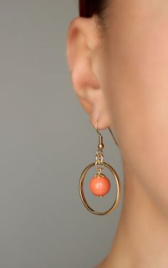 This lovely earrings was made of peach coral color glass 10 mm beads, gold plated brass bead caps, gold tone open circle charms and gold plated brass base earrings hooks. Earring hooks are from nickel free and lead free metal. *The total lenght of earrings is about 45 mm including earring hooks. Other earrings of my shop you can see here: https://www.etsy.com/shop/NaTavelli?section_id=13757927 Thanks for visit. Orange Dangle Pierced Jewelry, Orange Metal Jewelry With Matching Earrings, Orange Circular Jewelry As A Gift, Orange Circular Jewelry Gift, Gold Coral Earrings, Gold Circle Earrings, Boho Earring, Long Silver Earrings, Round Dangle Earrings