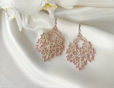 Top quality! Large lace earrings  are in trend this season! Tatting ivory earrings are very lightweight and comfortable to wear. These victorian beaded jewelry in vintage style will be an exclusive addition to your look! Two pairs of these beautiful earrings are available. Ideal for bridesmaids! I used cotton and silk threads of ivory color and dusty rose beads. Rhodium plated ear wear, hipoallergenic. MEASUREMENTS: earring height (minus ear wire): 5,7 cm  earring total height (including ear wire): 7,4 cm  earring width (widest point): 4,4 cm  These earrings are ready to be shipped. You can find exclusive jewelry boxes in the https://www.etsy.com/shop/LaditaArt store. Elegant Pink Beaded Earrings For Gift, Elegant Beige Flower Earrings For Gift, Elegant Beige Flower Earrings Gift, Delicate Handmade White Chandelier Earrings, Handmade Beige Earrings For Gift, Elegant Beige Beaded Earrings For Gift, Elegant Cream Flower Earrings, Handmade Lace Jewelry For Gifts, Delicate Handmade Chandelier Earrings Gift