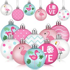 christmas ornaments with flamingos and palm leaves are arranged in the shape of an ornament